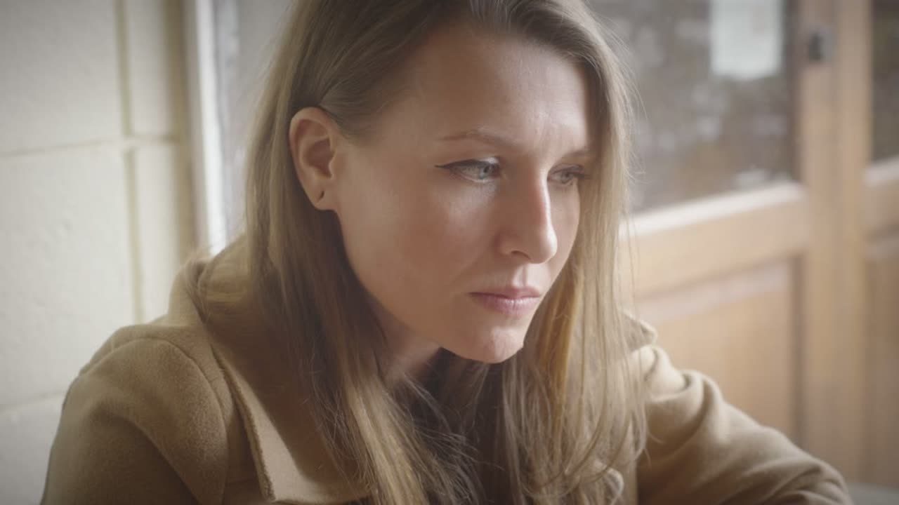 Christina Urso, the film&rsquo;s director, in close-up beside a window